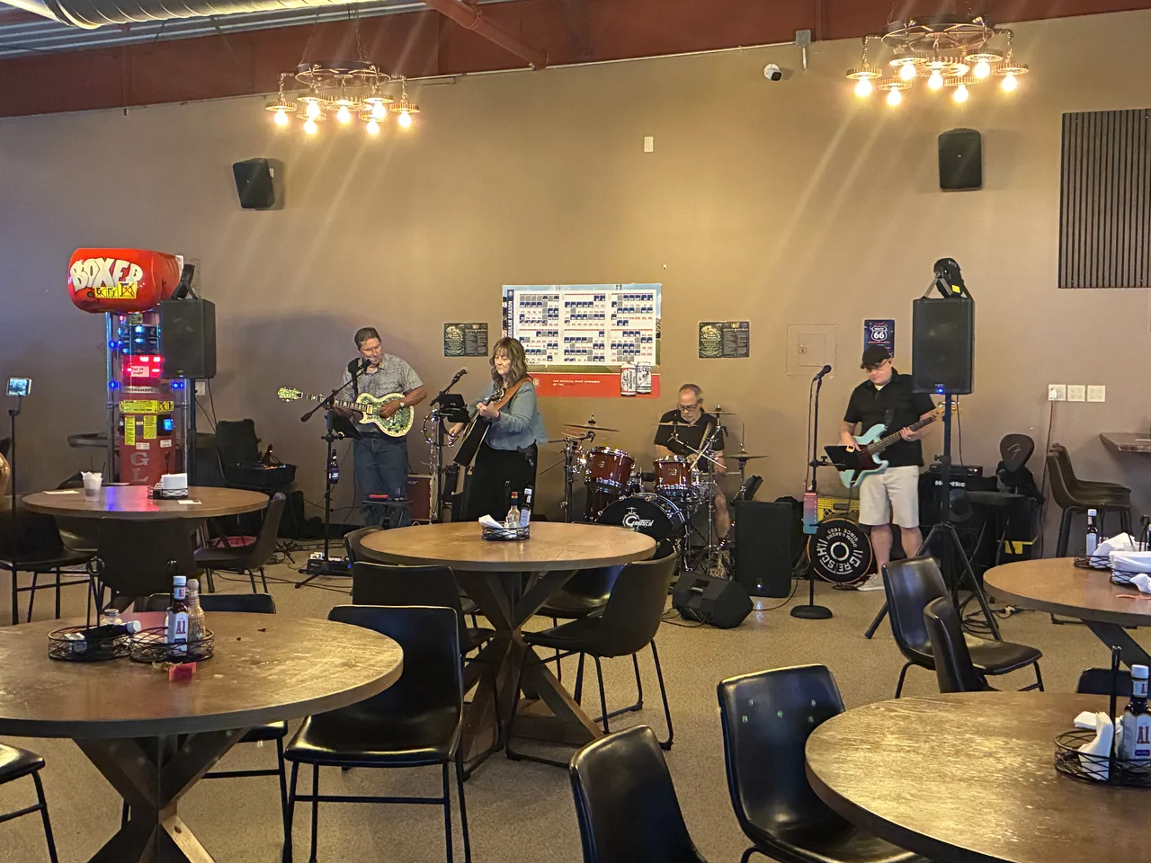 A live band performing among the actual tables and chairs at Kings