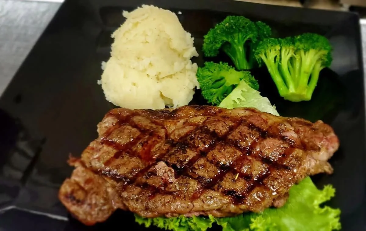 Kings ribeye steak with vegetables and mashed potatoes
